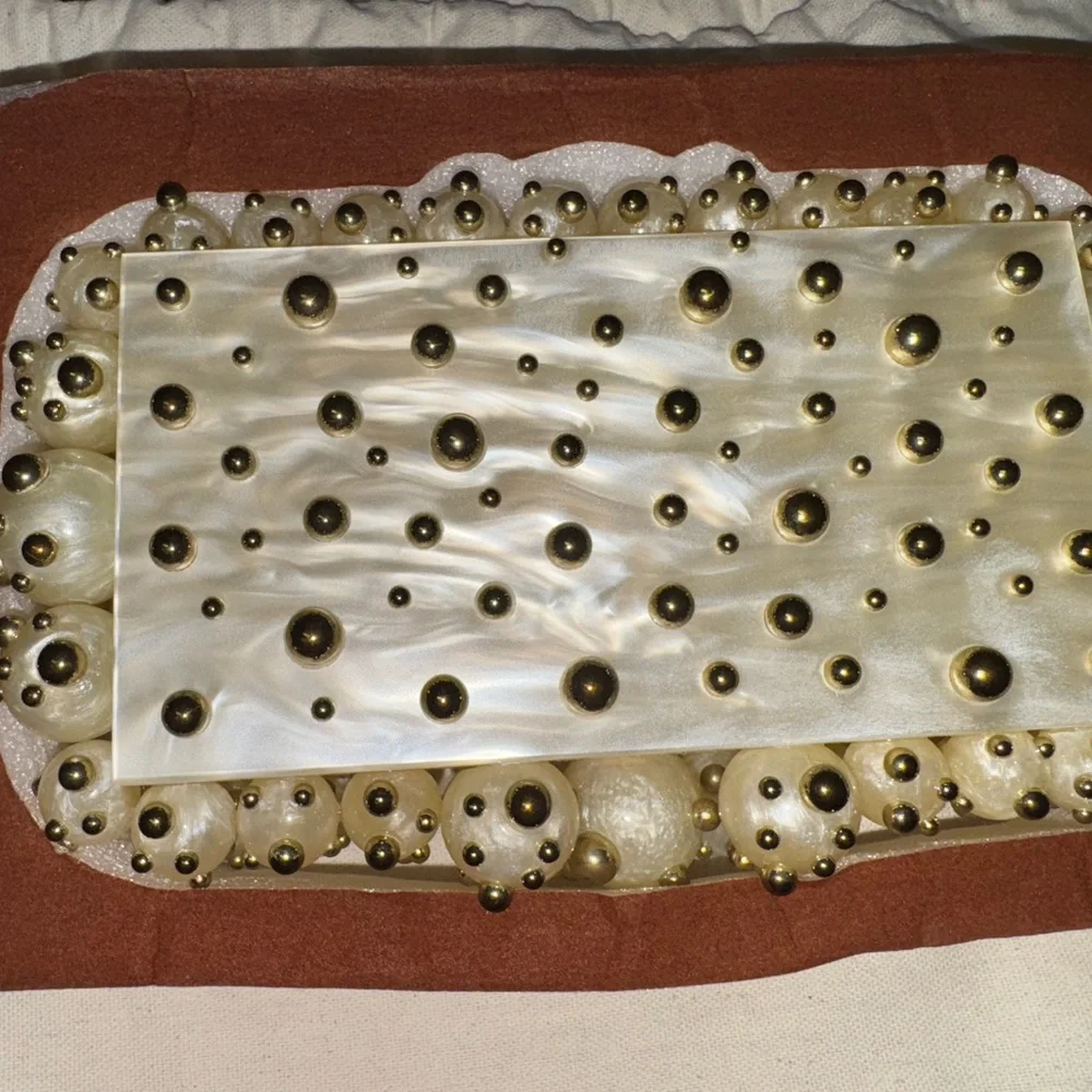 cult gaia Ivory & Shiny Brass Pearl-Embellished Eos Clutch